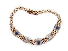 A VINTAGE SAPPHIRE AND DIAMOND GATE STYLE BRACELET. THE THREE SAPPHIRES AND TWO DIAMONDS ALL OLD CUT