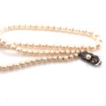 A MIKIMOTO GRADUATED PRINCESS STRING OF CULTURED AKOYA PEARLS, COMPLETE WITH A SILVER PEARL SET