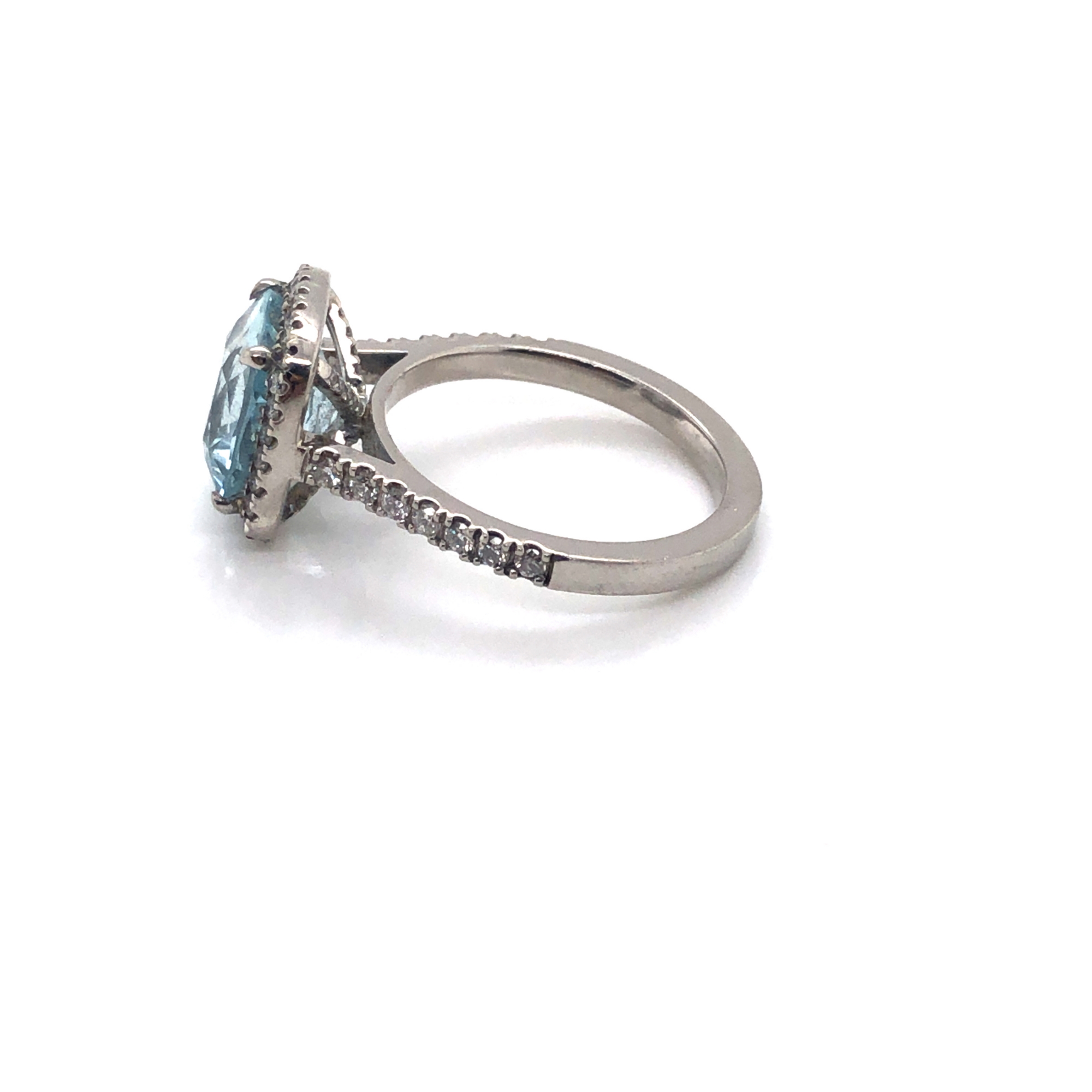 A CUSHION CUT AQUAMARINE AND DIAMOND HALO RING. THE SHANK STAMPED PLAT 950, AND ASSESSED AS - Image 4 of 7