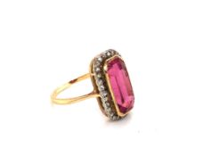 AN ANTIQUE ART DECO PINK TOURMALINE AND DIAMOND LOZENGE RING. THE PINK TOURMALINE MEASURING APPROX