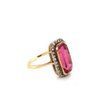 AN ANTIQUE ART DECO PINK TOURMALINE AND DIAMOND LOZENGE RING. THE PINK TOURMALINE MEASURING APPROX