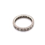 AN ANTIQUE DIAMOND FULL ETERNITY RING. UNHALLMARKED AND ASSESSED AS PLATINUM. THE ETERNITY BAND