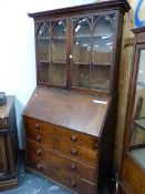 A GEORGE III OAK BUREAU BOOKCASE, THE GLAZED DOORS TO THE TOP EACH OF TWO LANCET TOPPED PANELS,