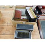 A VINTAGE STEREOSCOPIC VIEWER AND VARIOUS BOXED SLIDES AND PHOTOGRAPHS.