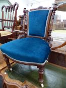 A VICTORIAN MAHOGANY NURSING CHAIR UPHOLSTERED IN BLUE VELVET TOGETHER WITH AN EDWARDIAN MAHOGANY EL