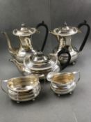 A HALLMARKED SILVER FIVE PIECE TEA AND COFFEE SERVICE DATED 1933 SHEFFIELD FOR WILLIAM HUTTON & SONS