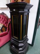 A PAIR OF VINTAGE BLACK PAINTED CANTED SQUARE SECTIONED ACHITECTURAL COLUMNAR PLINTHS WI