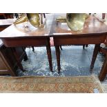 A 19th.C. MAHOGANY ROUNDED RECTANGULAR DINING TABLE WITH LINE INLAID APRON ABOVE THE TAPERING CYLIND