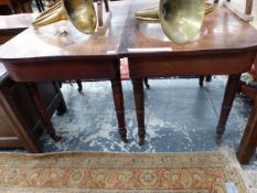 A 19th.C. MAHOGANY ROUNDED RECTANGULAR DINING TABLE WITH LINE INLAID APRON ABOVE THE TAPERING CYLIND