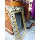 A BRASS FRAME PIERCED WITH ANTHEMION MOTIFS TOGETHER WITH A BRASS FRAMED MESH THREE FOLD FIRE GUARD