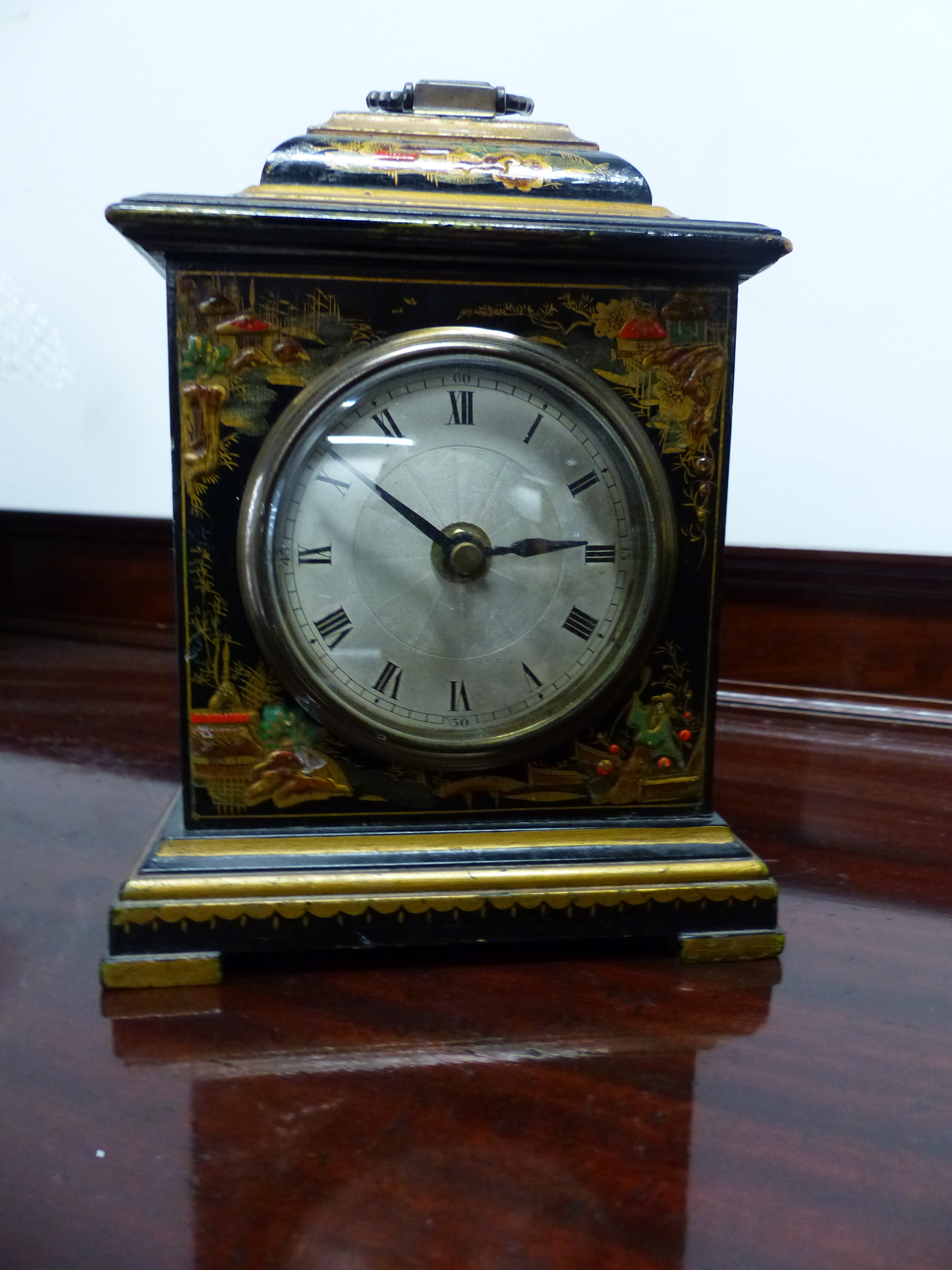 A CHINOISERIE DECORATED SMALL BRACKET CLOCK.