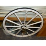 A VINTAGE CART WHEEL.