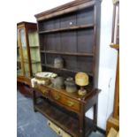 AN 18th C. OAK DRESSER WITH POT BOARD BASE. W 139 X D 43 X H 197cms.