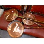 THREE ANTIQUE COPPER WARMING PANS.