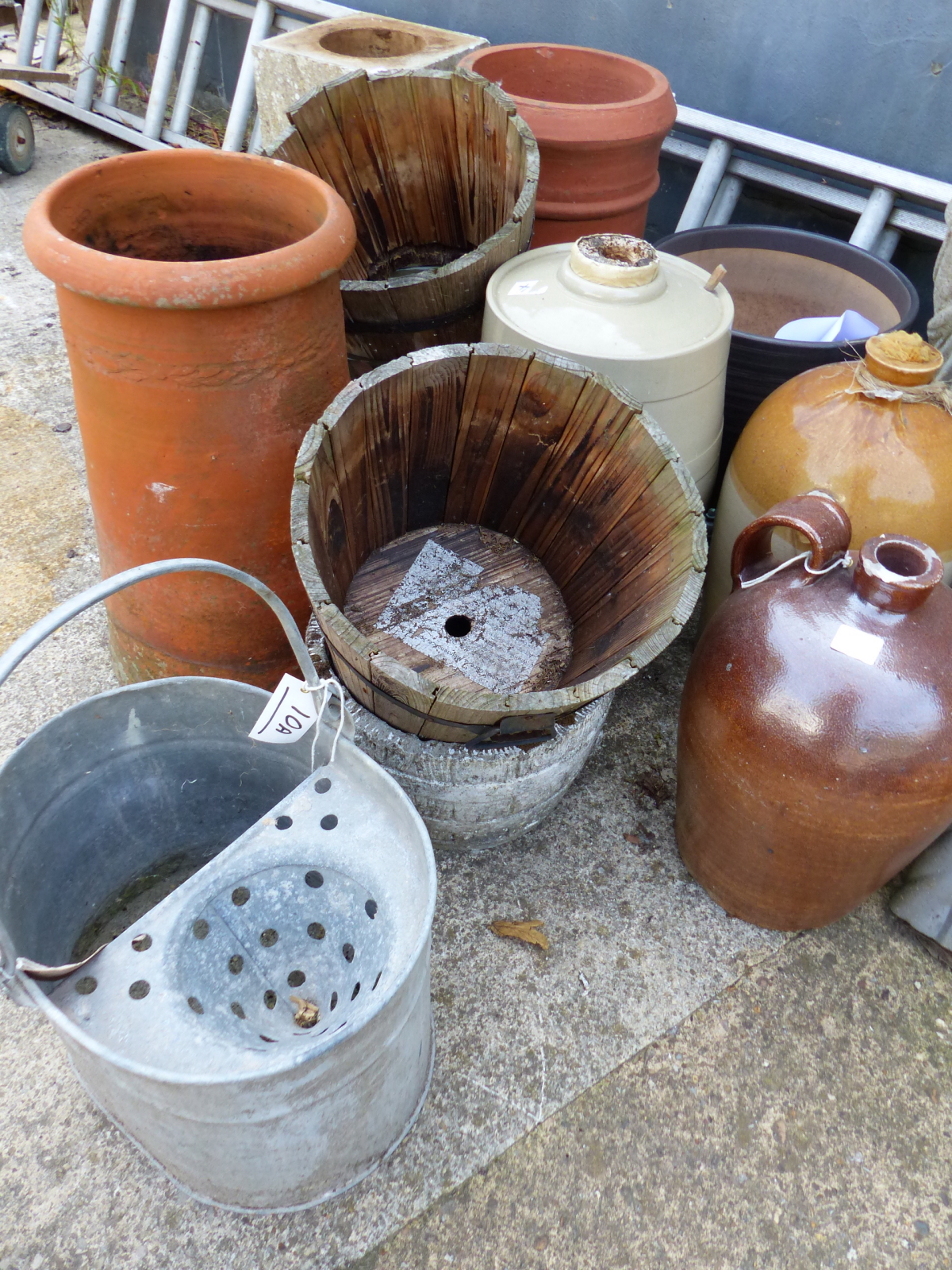 TWO CHIMNEY POTS, GARDEN PLANTERS, A COMPOSITE PLINTH, STONEWARE JARS AND A GALVANISED MOP BUCKET.