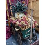 A HAND DRAWN CART CONTAINING DRIED FLOWERS IN A DOULTON JAR TO SELL VINEGAR AT A PENNY A PINT