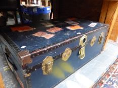 A VINTAGE BLUE CABIN TRUNK WITH IRON PROTECTED CORNERS AND OLD LABELLING. W 91cms.