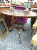 A COUNTRY OAK CIRCULAR TABLE ON BALUSTER COLUMN AND A TRIPOD. Dia. 91 x H 74cms.