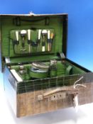 A VINTAGE GREEN CROCODILE DRESSING CASE FITTED WITH FOUR BOTTLES, A BRUSH AND A MANICURE SET, THE CA