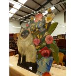 A SIAMESE CAT AND VASE OF FLOWERS DUMMY BOARD. H 60cms.