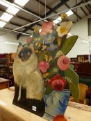 A SIAMESE CAT AND VASE OF FLOWERS DUMMY BOARD. H 60cms.