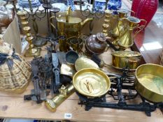 A PAIR OF LARGE IRON FIRE DOG FRONTS, VARIOUS BRASS CANDLE STICKS, OTHER BRASS WARES ETC.