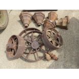 FIVE CAST IRON RAIN HOPPERS, A PAIR OF CAST IRON FINIALS, TWO PAIR OF CART WHEELS