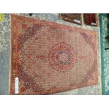 A PERSIAN RUG OF CLASSIC DESIGN. 229 x 155cms