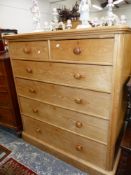 AN ASH CHEST OF TWO SHORT AND FOUR GRADED LONG DRAWERS ON PLINTH FOOT. W 123 x D 58 x H 133cms.