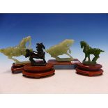 FOUR CHINESE HARDSTONE CARVINGS OF HORSES ON WOOD STANDS, THE LARGEST. W 12.5cms.