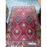 A PERSIAN TRIBAL RUG, 227 x 145cm. TOGETHER WITH A CONTINENTAL PILED RUG 160 x 95cm AND A PERSIAN