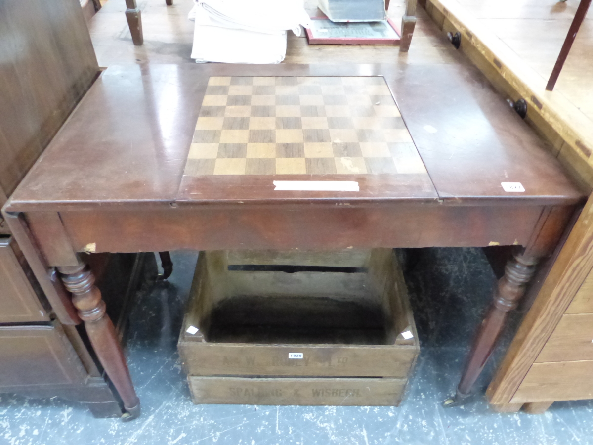 A REGENCY MAHOGANY FLAP TOP GAMES TABLE, THE CENTRAL CHESS BOARD SLIDING OUT TO REVEAL A RECESSED BA