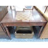 A REGENCY MAHOGANY FLAP TOP GAMES TABLE, THE CENTRAL CHESS BOARD SLIDING OUT TO REVEAL A RECESSED BA
