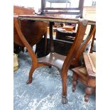 A MAHOGANY GAMES TABLE, THE CIRCULAR TOP REVOLVING TO SHOW A PLAIN WOODEN SURFACE ON ONE SIDE AND