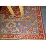 AN ANTIQUE TURKISH OUSHAK CARPET (REJOINED AND ALTERED IN SIZE) 448 x 325cm