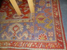 AN ANTIQUE TURKISH OUSHAK CARPET (REJOINED AND ALTERED IN SIZE) 448 x 325cm