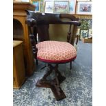 A VICTORIAN MAHOGANY YACHT CHAIR ROTATING ON AN IRON STAND SUPPORTED ON WOODEN PLINTH OF Y-SHAPE, TH