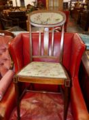 AN EDWARDIAN MARQUETRIED MAHOGANY SIDE CHAIR WITH FLORAL UPHOLSTERED TOP RAIL AND SEAT