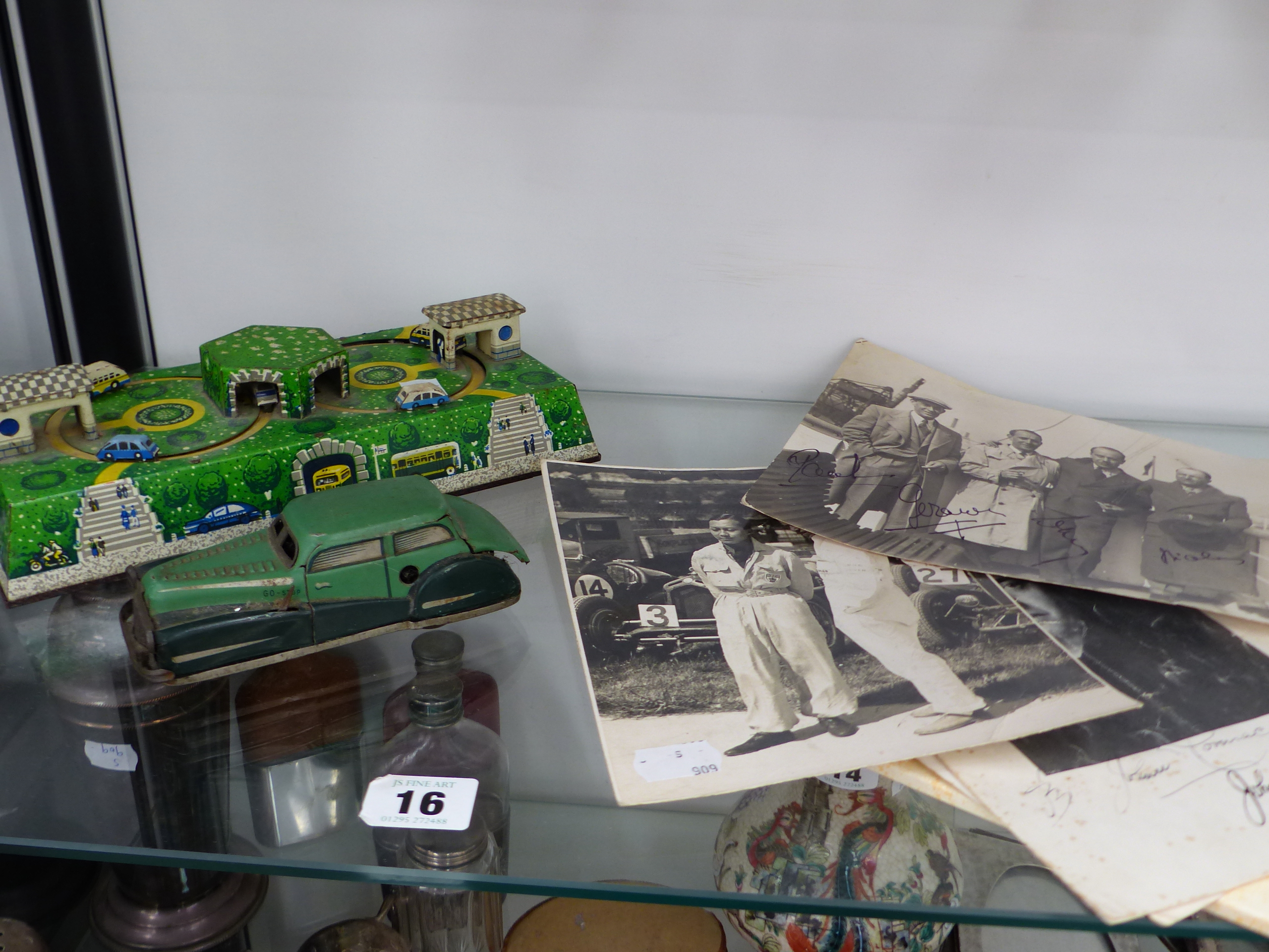 THREE MOTOR RACING RELATED PHOTOGRAPHS, TOGETHER WITH A FRENCH CLOCKWORK CAR, AND A FURTHER