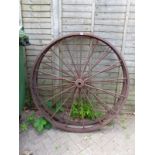 A PAIR OF CAST IRON WAGON WHEELS