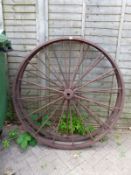 A PAIR OF CAST IRON WAGON WHEELS