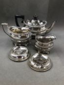 A HALLMARKED SILVER THREE PIECE BACHELORS TEA SET DATED 1905, 06 AND 1912, FOR GEORGE NATHAN &