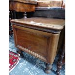 A VICTORIAN MAHOGANY COMMODE, THE RECTANGULAR LID OPENING OVER A WHITE CERAMIC FITTING AND SUPPORTED