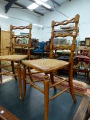 A PAIR OF VICTORIAN CANED SIDE CHAIRS, EACH WITH THREE TRIPLE LOOPED HORIZONTAL BAR BACKS