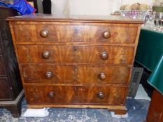 A GEORGIAN WALNUT CHEST OF FOUR GRADED DRAWERS ON BRACKET FEET