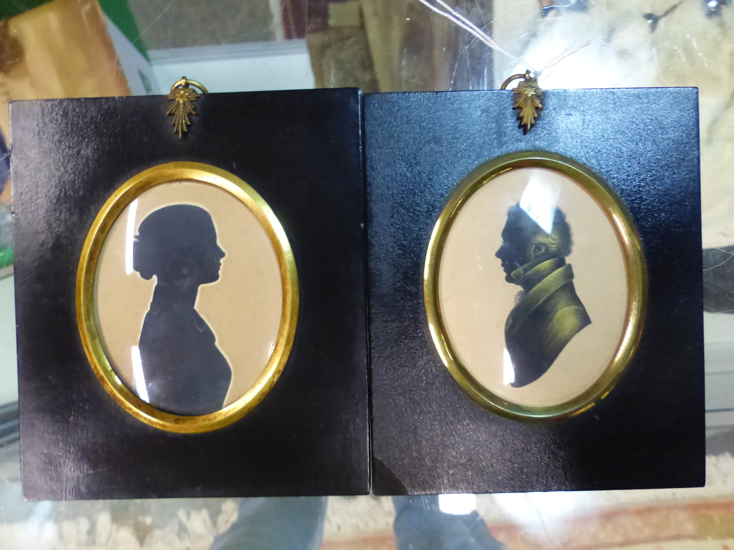 TWO OVAL SILHOUETTESOF A LADY AND OF A GENTLEMAN, THE LATTER WITH GILT DETAILING AND FAINT