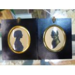 TWO OVAL SILHOUETTESOF A LADY AND OF A GENTLEMAN, THE LATTER WITH GILT DETAILING AND FAINT