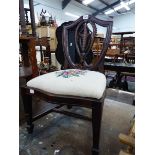 A CHILDS MAHOGANY SHIELD BACK CHAIR WITH PINK ROSE NEEDLE WORK SERPENTINE FRONTED SEAT ABOVE