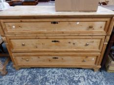 A VICTORIAN PINE CHEST OF THREE LONG DRAWERS ON BRACKET FEET. W 137 x D 63 x H 90cms.