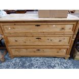 A VICTORIAN PINE CHEST OF THREE LONG DRAWERS ON BRACKET FEET. W 137 x D 63 x H 90cms.